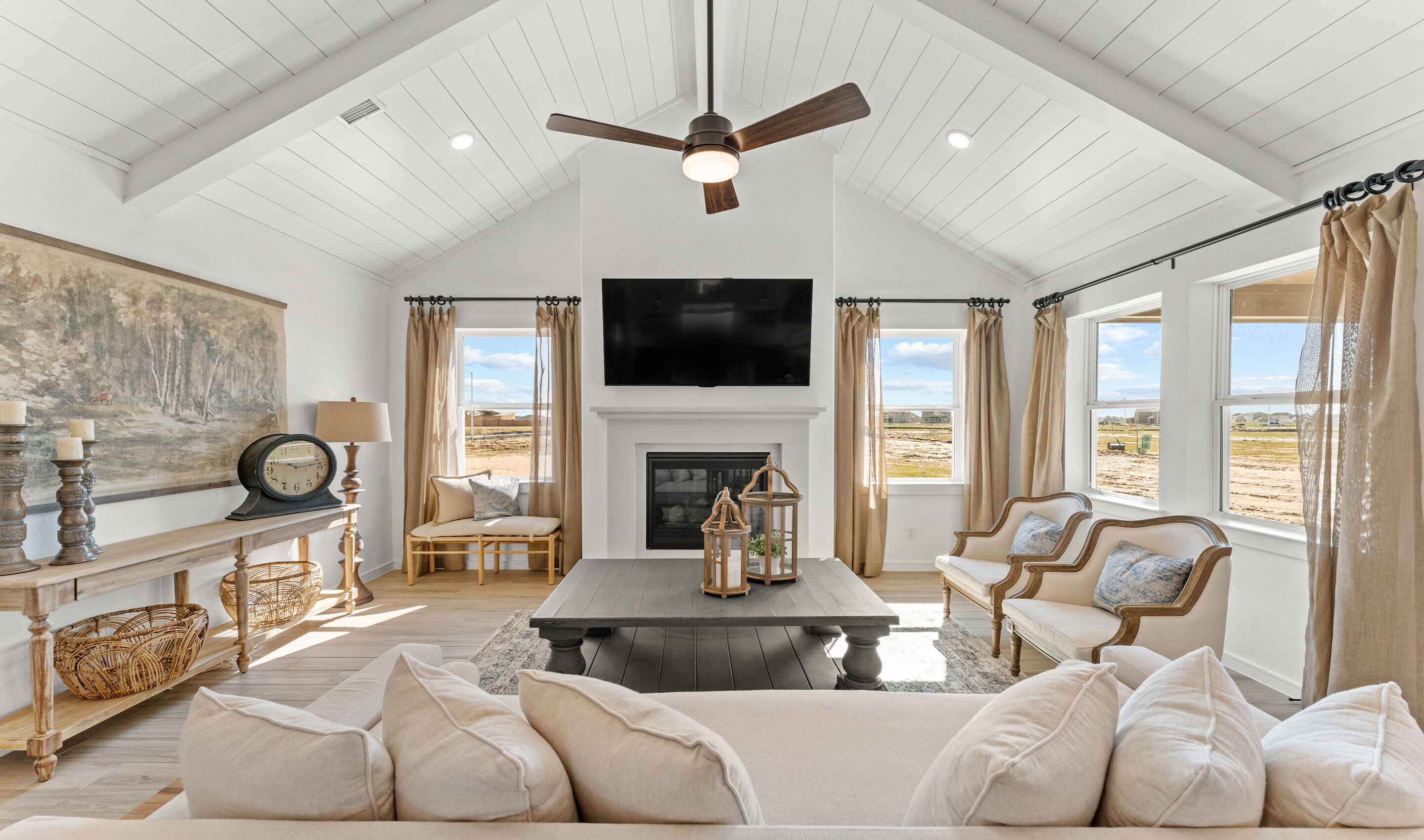 Great room with white painted shiplap and vaulted ceiling